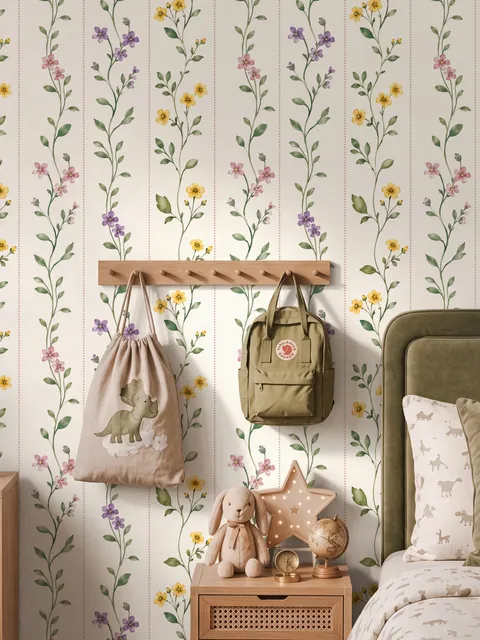 Cute floral wallpaper with green vine trails and pink, purple and yellow watercolor flowers on cream