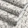 Black outline botanical wallpaper with charcoal wildflowers and grasses on a warm ivory cream ground