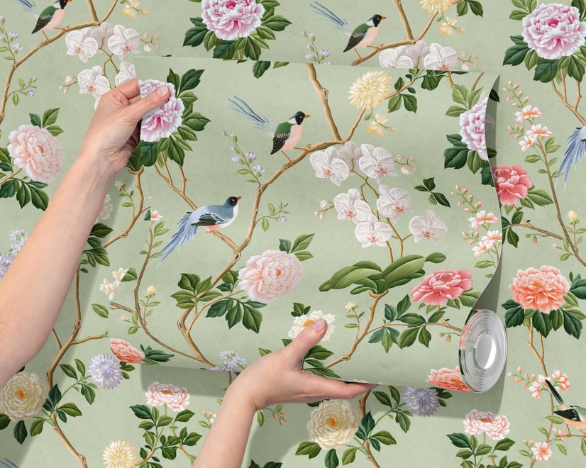 Celadon-sage chinoiserie wallpaper with blue-grey birds, tan branches, pink peonies and white orchids