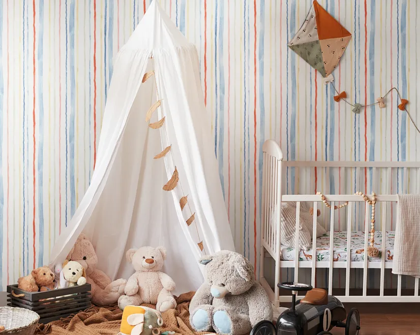 Blue and light blue wallpaper with hand-painted vertical watercolour stripes on a clean white ground