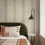 Gold and white wallpaper with antique gold leafy sprig stripes on parchment cream