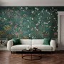 Floral wallpaper with birds in a teal chinoiserie garden with blossoms, pheasant, palms and stone railings