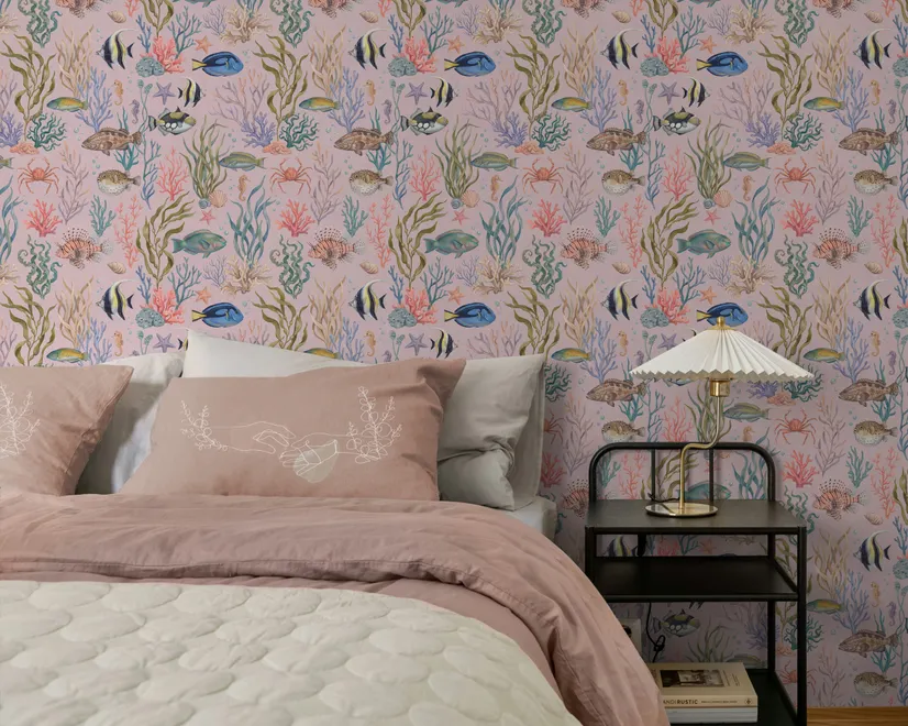 Cute pink seashell wallpaper with watercolour reef fish, coral, seaweed, starfish and shells on blush pink