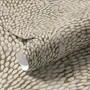 Abstract taupe and greige wallpaper with creamy white oval brush marks in flowing currents