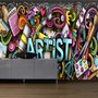 Dessin d'un artiste graffiti avec une peinture colorée papier peint panoramique