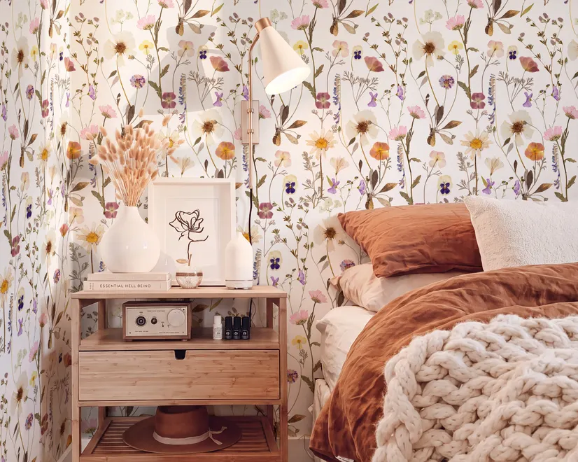 Cute spring wallpaper with pressed ivory, pink, blue and yellow wildflowers on a white ground