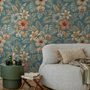 Blue tropical wallpaper with hibiscus, orchids, lilies, monstera leaves and palm fronds on a deep teal-blue ground