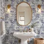 Jungle wallpaper with animals in navy toile, showing tigers, elephants and monkeys on an ivory cream ground