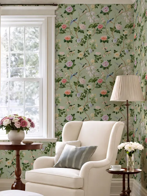 Celadon-sage chinoiserie wallpaper with blue-grey birds, tan branches, pink peonies and white orchids