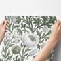 Sage green botanical floral wallpaper with white poppy flowers, lobed leaves and dotted seed centres