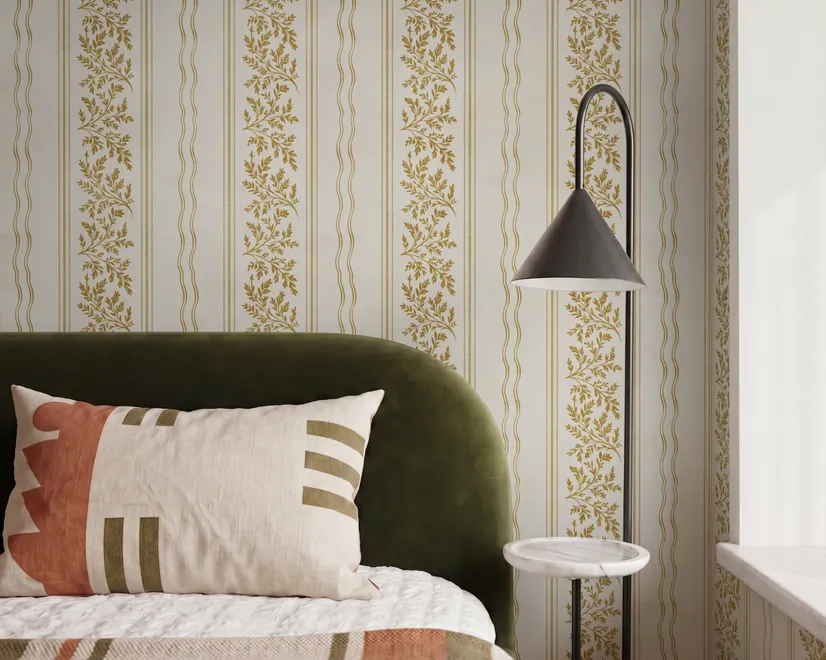 Gold and white wallpaper with antique gold leafy sprig stripes on parchment cream