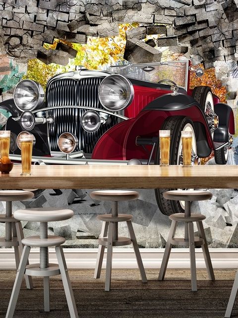 Papier peint panoramique voiture vintage avec graffiti sur mur de briques