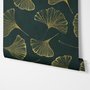 Dark green wallpaper with metallic antique-gold etched ginkgo leaves on a textured forest-green teal ground