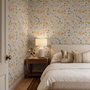 Spring floral wallpaper with pastel watercolour flowers and sage leaves on a clean white ground
