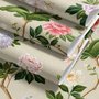 Chinoiserie wallpaper with blue-grey birds, pink peonies, white orchids and green branches on ivory-cream ground