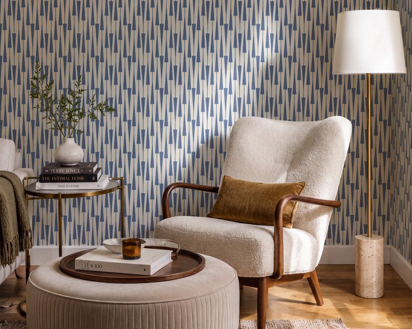 Cream colored wallpaper with denim blue geometric totem stripe repeat on a linen texture ground