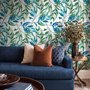 Dark olive green wallpaper with teal and cobalt watercolour lance leaves on a white ground