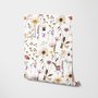Cute spring wallpaper with pressed ivory, pink, blue and yellow wildflowers on a white ground