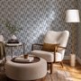 Cream colored wallpaper with denim blue geometric totem stripe repeat on a linen texture ground
