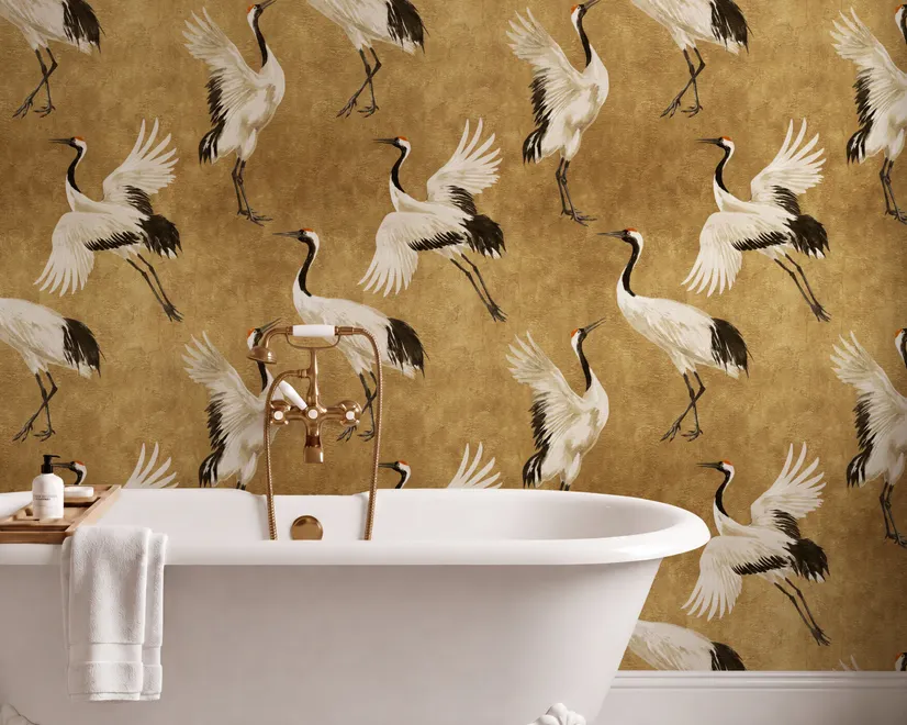 Japanese crane wallpaper with white, black and red cranes in flight on an antique-gold textured ground