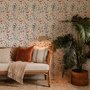 Watercolour floral wallpaper repeat with navy, blue, blush and peach wildflowers on warm cream