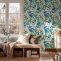 Dark olive green wallpaper with teal and cobalt watercolour lance leaves on a white ground
