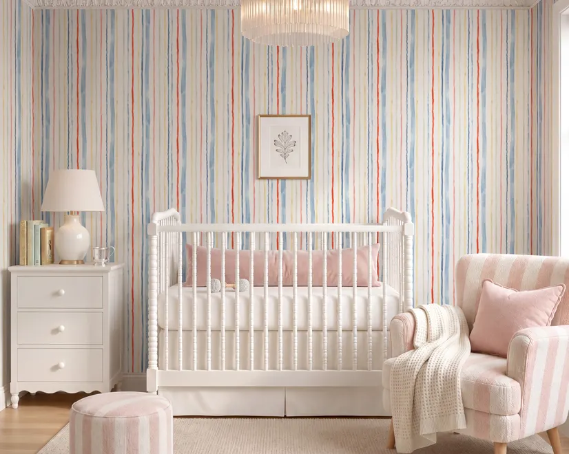 Blue and light blue wallpaper with hand-painted vertical watercolour stripes on a clean white ground