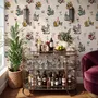 Bar area wallpaper with hand drawn cocktails, liquor bottles, citrus and fruit bowls on warm cream