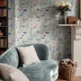 Modern coastal wallpaper with watercolour tropical fish, coral, seaweed, shells and bubbles on light aqua-blue