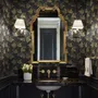 Black wallpaper with antique metallic gold ginkgo leaves on a mottled charcoal ground