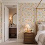 Spring floral wallpaper with pastel watercolour flowers and sage leaves on a clean white ground