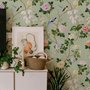 Celadon-sage chinoiserie wallpaper with blue-grey birds, tan branches, pink peonies and white orchids