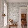 Black outline botanical wallpaper with charcoal wildflowers and grasses on a warm ivory cream ground