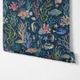 Aquarium fish tank wallpaper repeat with tropical fish, coral, seaweed, shells and bubbles on deep navy blue