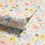 Spring floral wallpaper with pastel watercolour flowers and sage leaves on a clean white ground