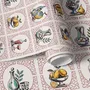 Bar wallpaper with cream tile grid, dusty rose arches, illustrated wine bottles, fruit and café still lifes