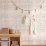 Soft brown wallpaper with pale beige gingham checks on a warm cream off-white ground