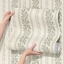 Green aesthetic wallpaper with sage leafy sprigs, fine vertical rules and dotted borders on cream ivory