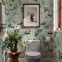 Chinoiserie wallpaper with peach birds, orchids and peonies on a pale duck egg blue ground