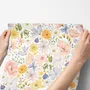 Spring floral wallpaper with pastel watercolour flowers and sage leaves on a clean white ground