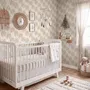 Muted sandy taupe palm trees and pale foliage on a creamy ivory ground tropical wallpaper