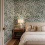 Sage green botanical floral wallpaper with white poppy flowers, lobed leaves and dotted seed centres