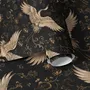 Ivory cranes and antique gold lotus flowers on charcoal-black Japanese lotus wallpaper