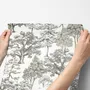 Monochrome wallpaper with grey tree toile on a clean white ground