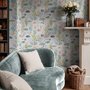 Modern coastal wallpaper with watercolour tropical fish, coral, seaweed, shells and bubbles on light aqua-blue