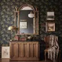 Black wallpaper with antique metallic gold ginkgo leaves on a mottled charcoal ground