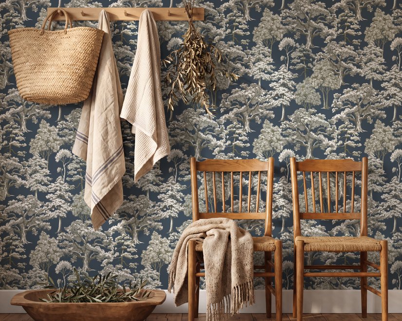Navy wallpaper with warm ivory and taupe grey toile tree repeat on deep slate blue ground