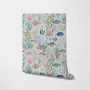 Modern coastal wallpaper with watercolour tropical fish, coral, seaweed, shells and bubbles on light aqua-blue
