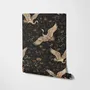 Ivory cranes and antique gold lotus flowers on charcoal-black Japanese lotus wallpaper