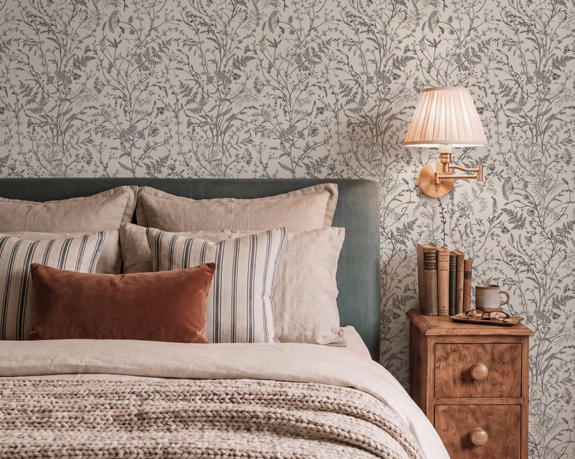 Black outline botanical wallpaper with charcoal wildflowers and grasses on a warm ivory cream ground